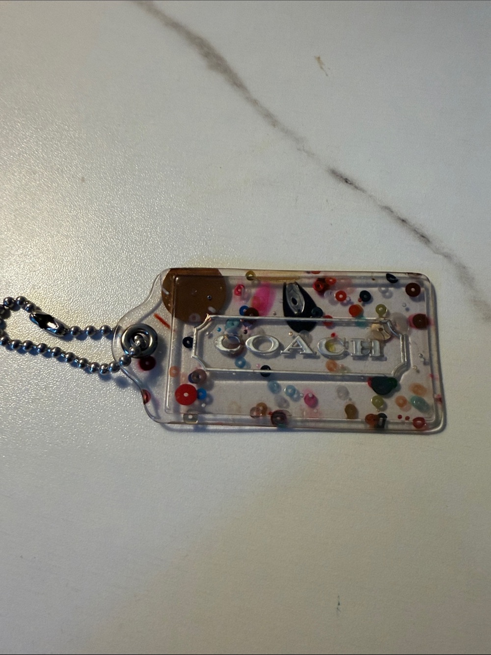 COACH Clear Confetti Acrylic Tag- Multicolor